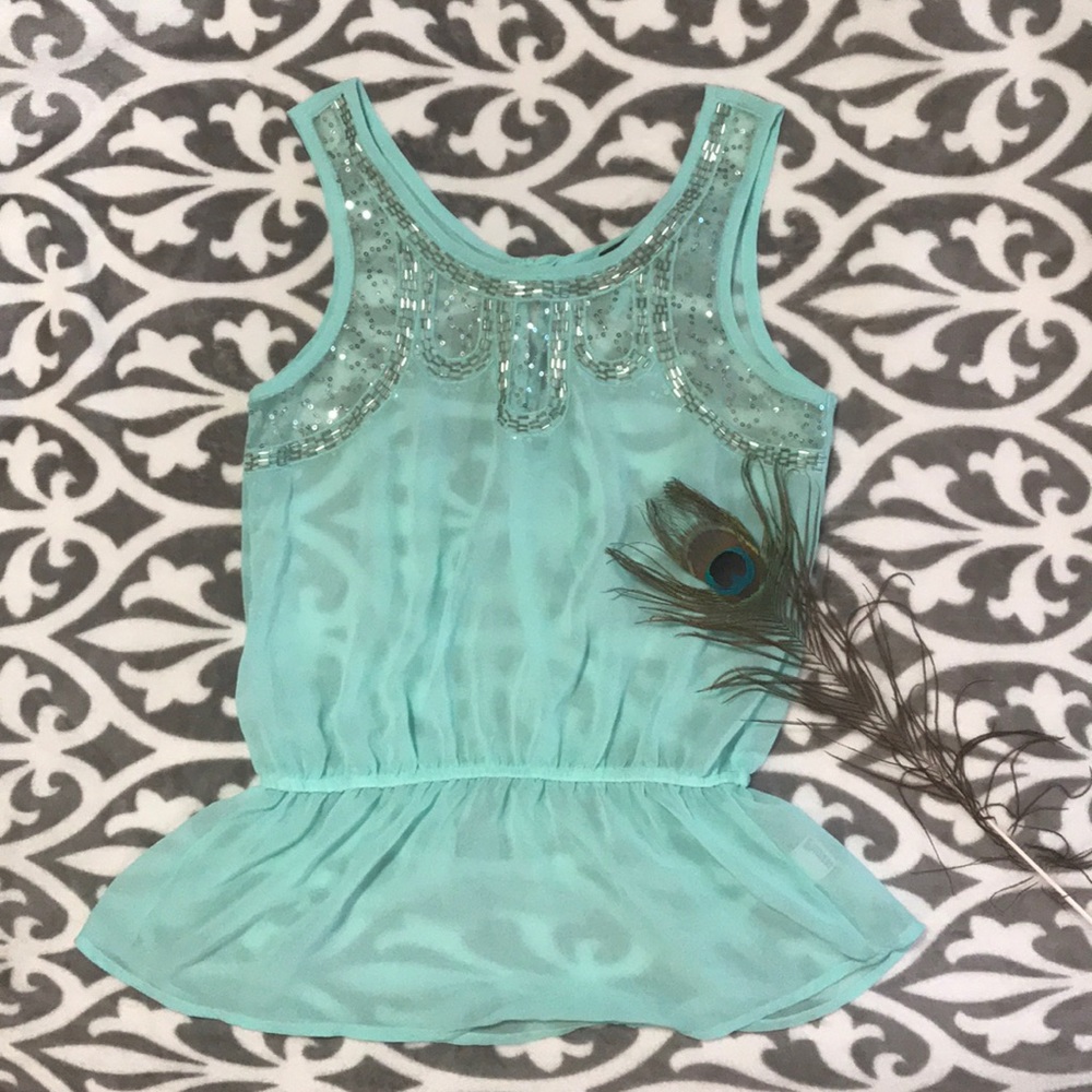 Sheer beaded peplum top